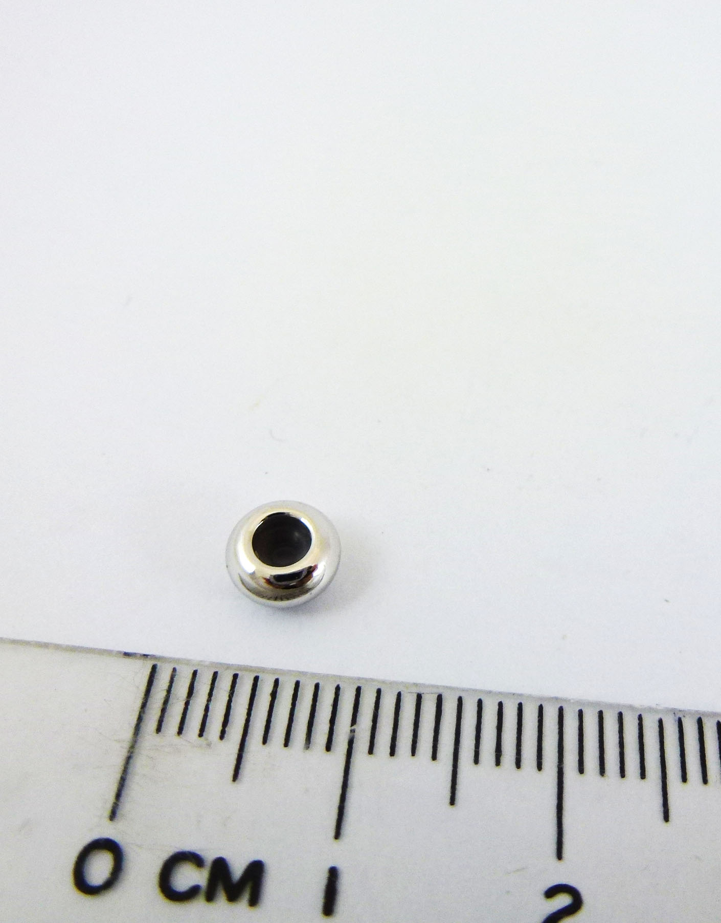 6mm銅鍍正白K中洞圓圈矽膠擋珠